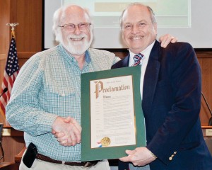 Mayor Clough presents outgoing Planning Director Parry with a City Proclamation.
