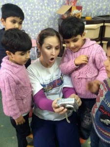 Nicki Vacco, RN, with refugee children in Jordan