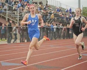 Bay’s Amanda Cusimano (5;15.90) edges Chloe Bierut of Rocky River in the 1600 meter run.