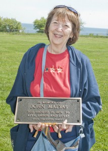 Pat Matyas with the plaque honoring her late husband, John.