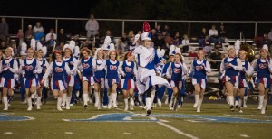 The Bay High Marching Band makes an enthusiastic entrance on the field for Friday’s halftime show.