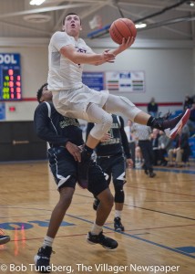 John Koz goes up for two points in a win over Elyria Catholic.