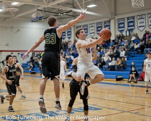 Jack Jelen drives the lane as Bay picked up a conference win against Elyia Catholic Tuesday night.