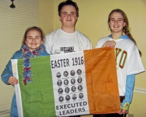 Kate, Tommy & Ellen Lavelle holding the flag sent from Ireland.