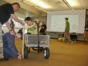 Goodyear STEM Career Day 2016 - David Eppele tests tire pressure in cart-1