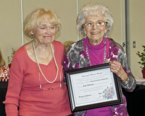 Diane Ruma presents the award to Elsie Pobinson.