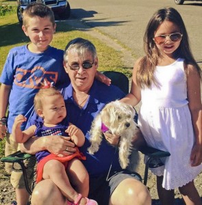 Tom Moran with his grandchildren and late dog, Charlotte.