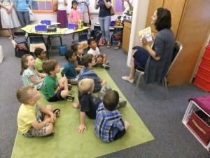 Kourtney Sladek reading to children